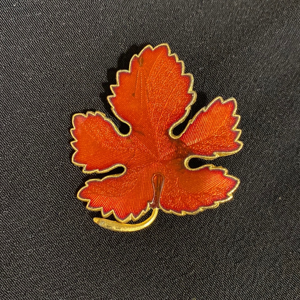 Gold tone leaf pin with burnt orange enamel finish